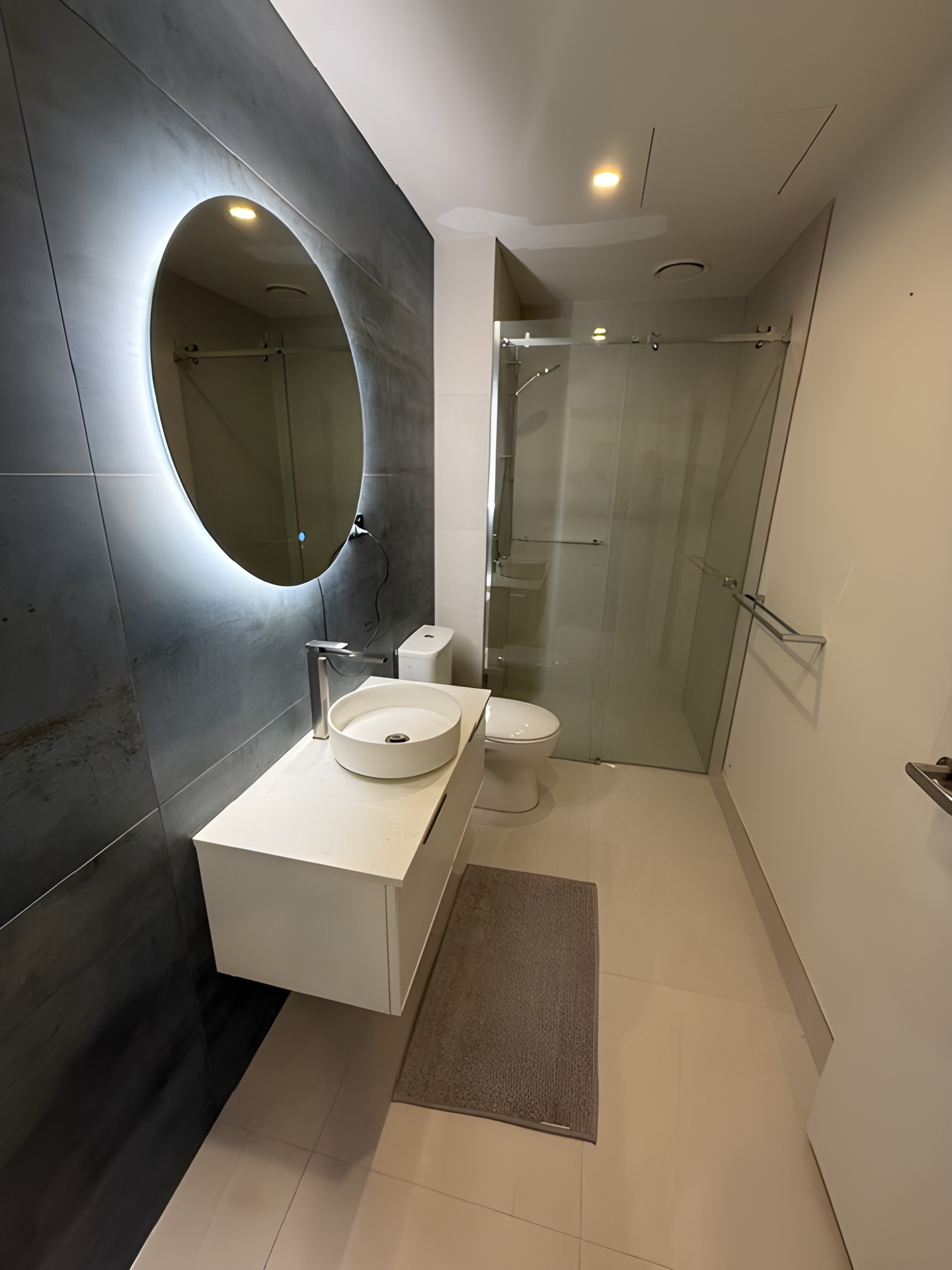 Renovated bathroom with modern tiling