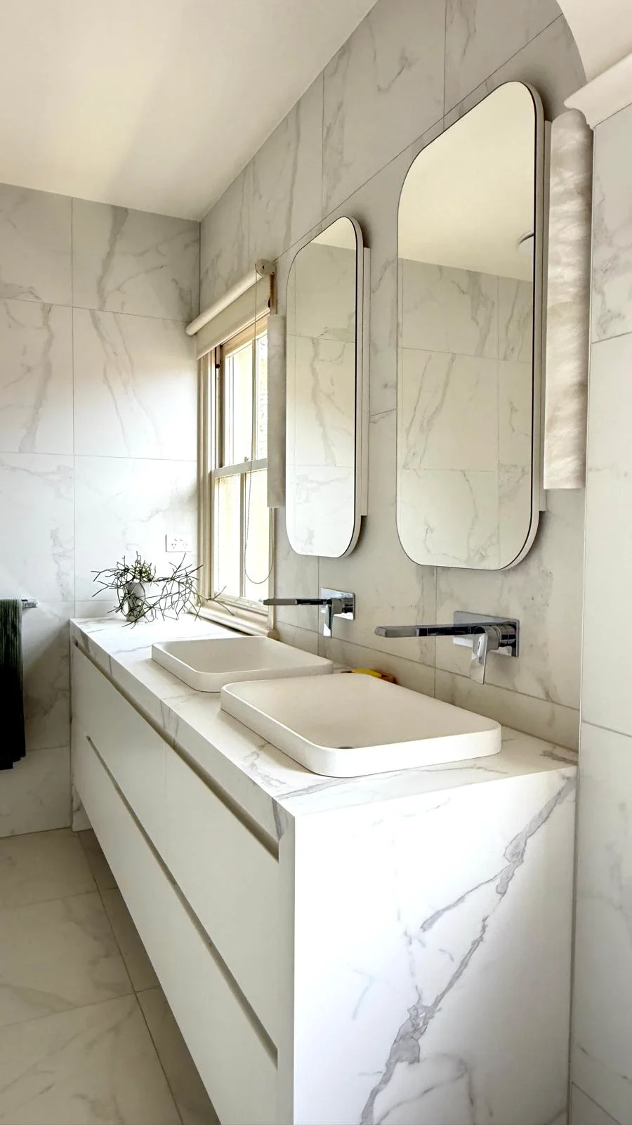 Bathroom renovation with floor-to-ceiling tiles