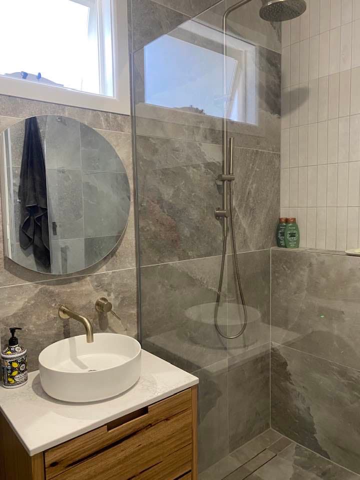 Bathroom transformation with floor-to-ceiling tiles